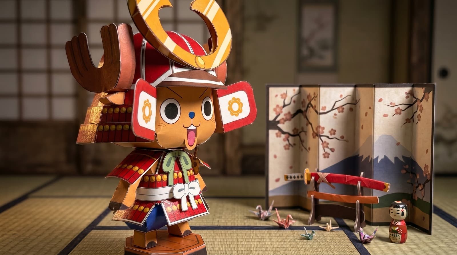 A finished Subara papercraft samurai character displayed beside a folded paper screen